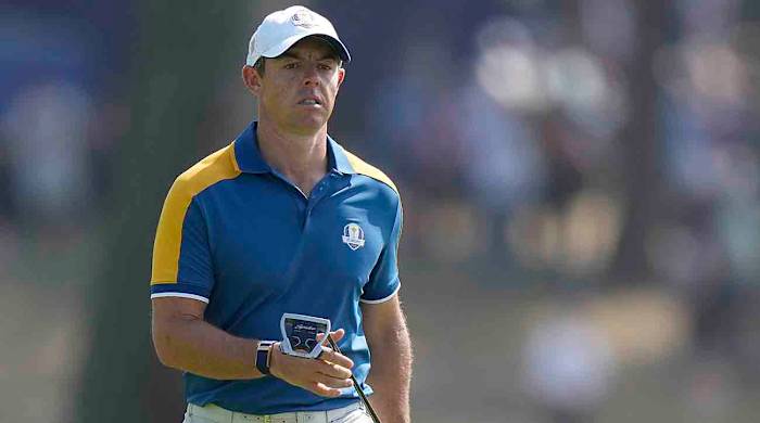 Europe's Rory McIlroy walks on the 2nd green during his singles match at the 2023 Ryder Cup.
